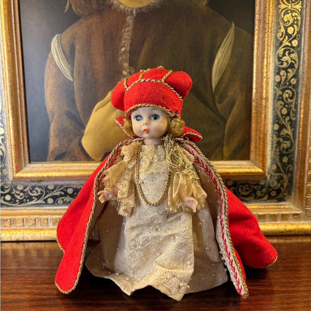 Vintage Renaissance-Style Porcelain Doll with Red Cape and Embroidered Dress
